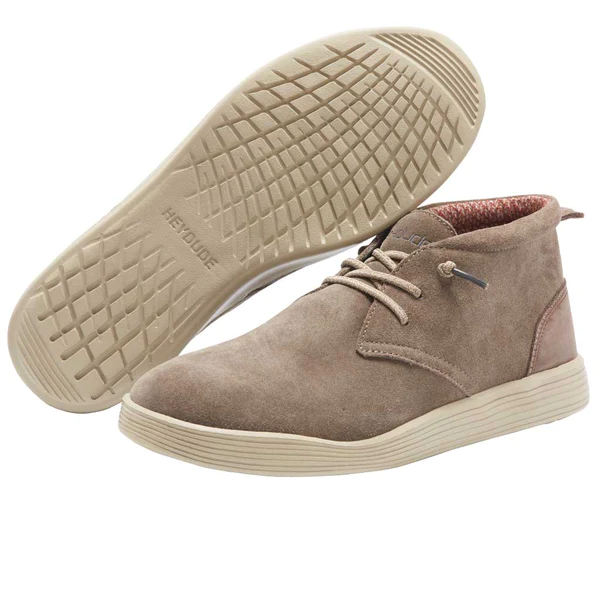 "Angled and sole view of Heydude 112374962 men's light brown suede shoe featuring beige textured sole with ‘heydude’ branding, red-accented inner lining, and simple lace-up design."