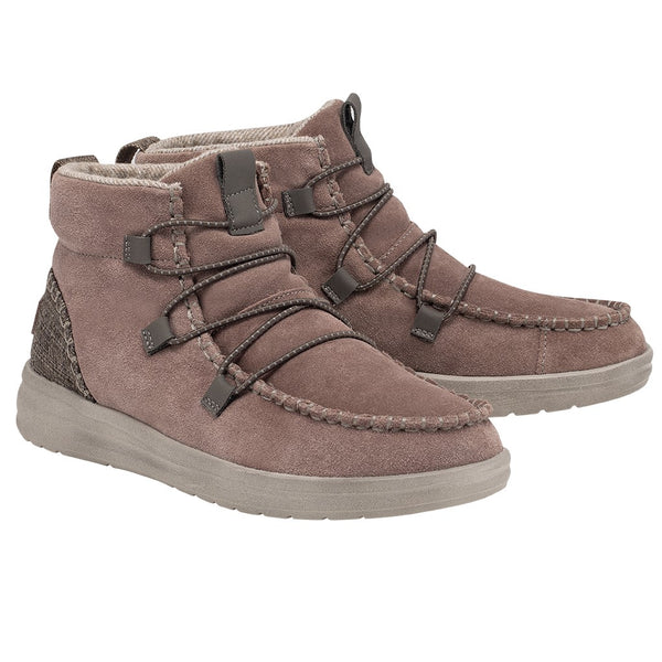 "Side profile of a HeyDude men's high-top casual shoe, model 122015006, featuring a brown suede upper, elastic brown laces, textured fabric heel patch, and a light gray sole."
