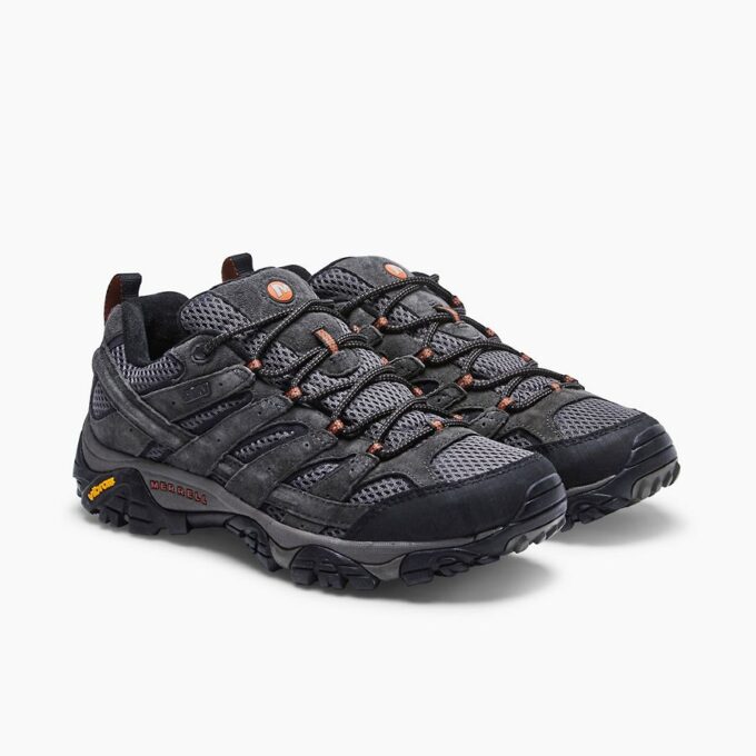 "Pair of Merrell J06029 hiking shoes in dark gray with black and orange accents, shown from a front-side angle."