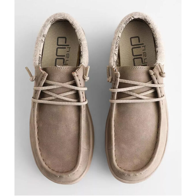 "Top view of Heydude Polly Light Taupe shoes featuring a soft beige suede upper, cozy fleece lining, and criss-cross elastic laces."