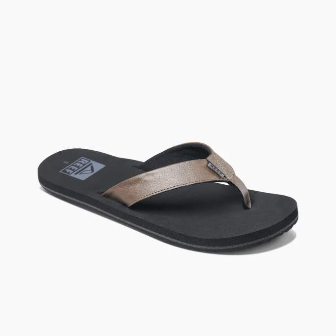 "Angled view of Reef RF002915GRE sandal showcasing a brown leather strap, black cushioned footbed, and the Reef logo printed near the heel."