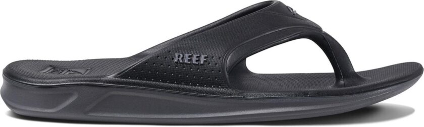 "Side view of the Reef RF0A3ONCBLA sandal in all-black design, featuring a molded footbed, perforated side panel, and a contoured thong strap with embossed REEF branding."