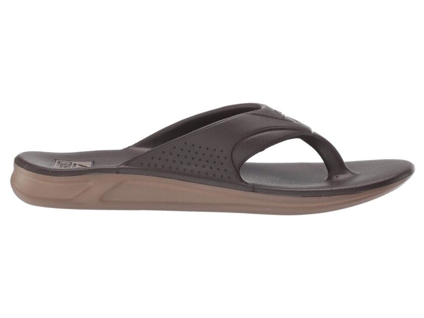 "Side view of a brown Reef RF0A3ONCBRO sandal showing its contoured footbed, perforated strap, and two-tone sole design."