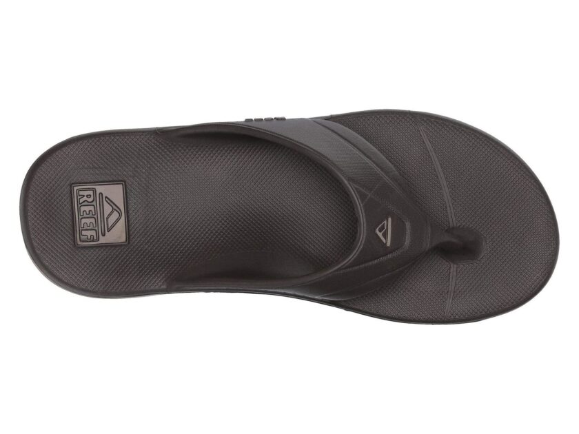 "Top view of a single brown Reef RF0A3ONCBRO thong sandal featuring a textured footbed and molded strap with Reef logo detail."