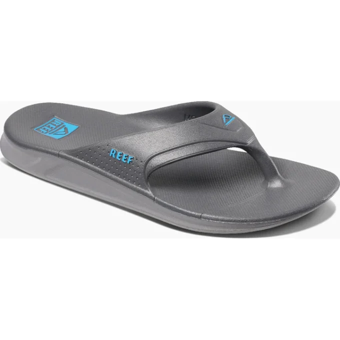 "Angled side view of a gray Reef flip-flop sandal with blue Reef branding on the strap and footbed."