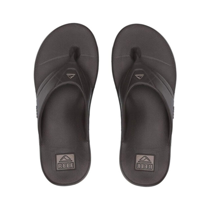 "Top view of Reef One RF0A3ONCBRO men's brown thong sandals, featuring a sleek, water-friendly design with textured footbeds and molded rubber straps for all-day comfort."