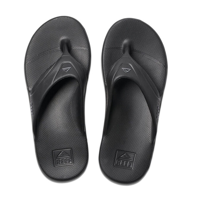 "Top view of Reef RF0A3ONCBLA men's black thong sandals, featuring water-friendly construction with contoured textured footbeds and molded straps for all-day comfort and grip."