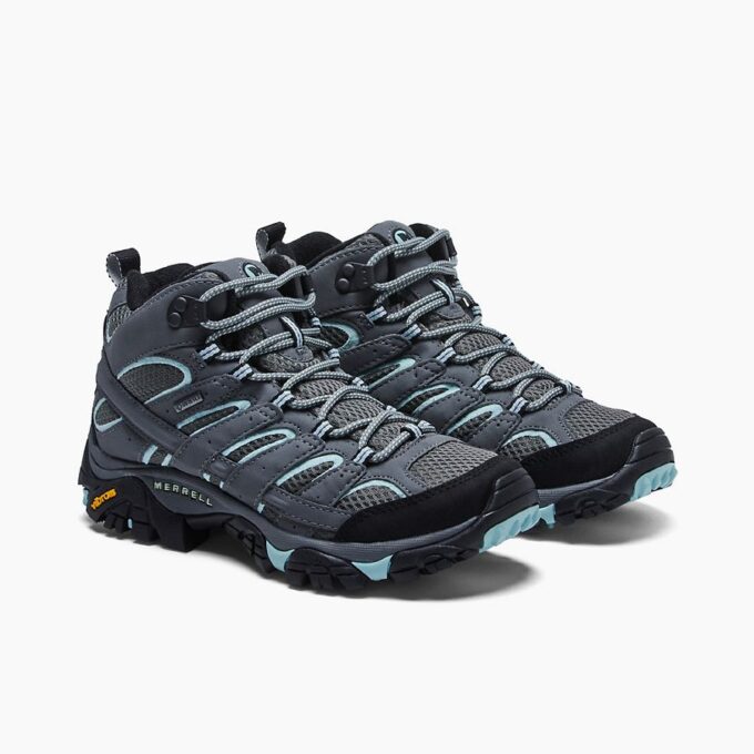 "Angled front view of the Merrell J06060 hiking shoes in grey with teal accents, featuring a breathable mesh and synthetic upper, secure lace-up closure, cushioned midsole, and a rugged Vibram outsole for traction."