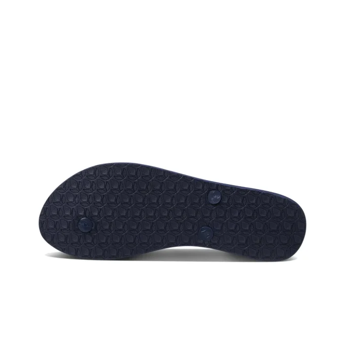 "Bottom view of Reef RF001949MRD sandal showing textured navy blue rubber outsole with circular strap plugs."