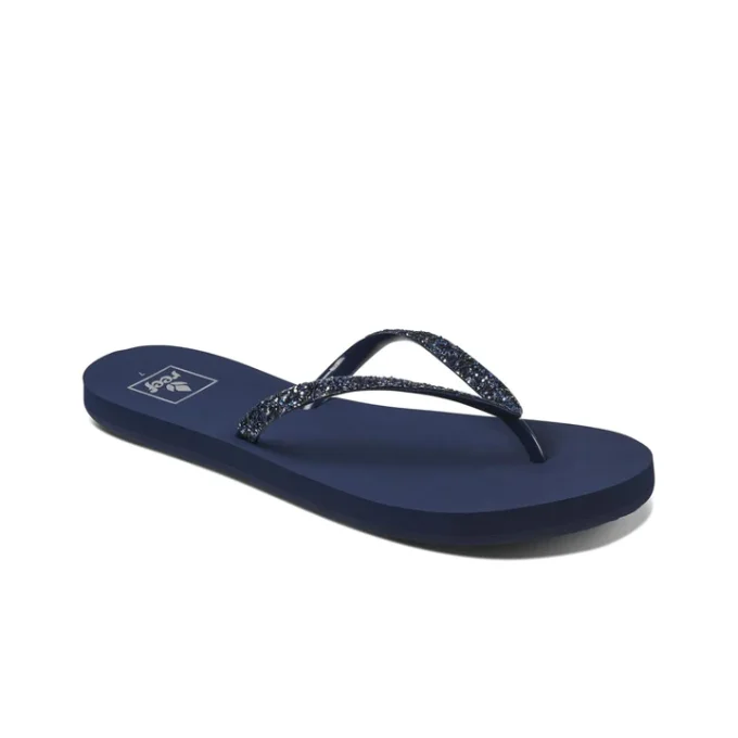 "Angled view of Reef RF001949MRD women's sandal featuring a navy blue footbed and glittery dark blue thong straps."