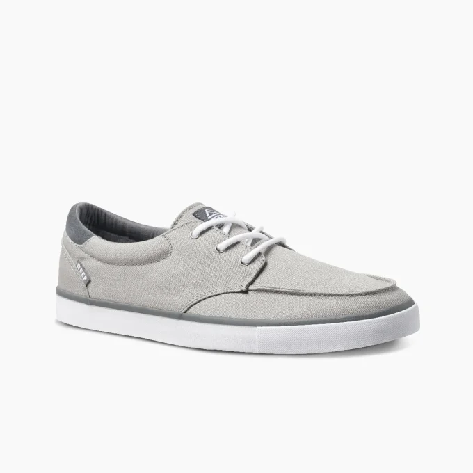 "Angled side view of Reef RF0A3FE4GRW gray canvas sneaker with white laces, dark gray heel collar, and white rubber outsole with gray trim."