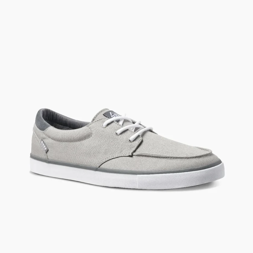 "Angled side view of Reef RF0A3FE4GRW gray canvas sneaker with white laces, dark gray heel collar, and white rubber outsole with gray trim."