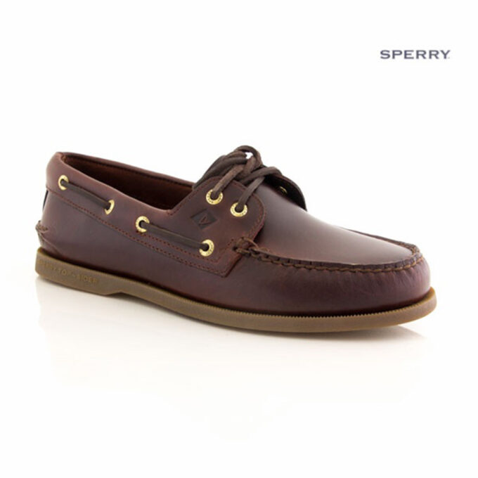 "Side view of a Sperry A/O Amaretto boat shoe in smooth dark brown leather with moc-toe stitching, gold eyelets, brown leather laces, and a light brown rubber sole."