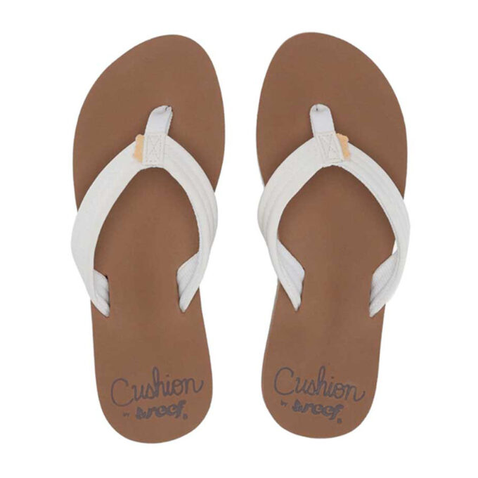 "Front view of Reef Cushion sandals pair (model RF001454CLD) featuring a white thong strap, tan cushioned EVA footbed, and brown sole. Key features: arch support, PVC-free materials, and cushioned EVA comfort."
