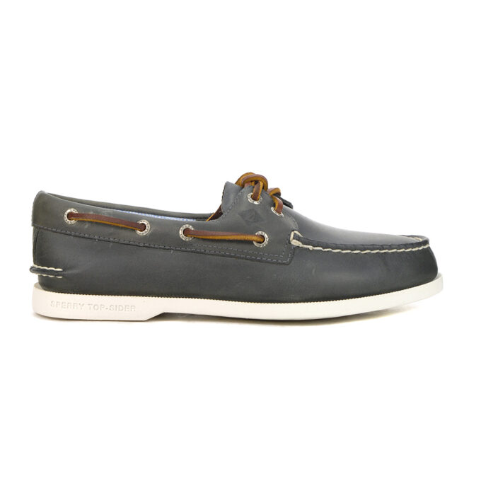 "Side view of a dark gray Sperry A/O 2-Eye Plush Wave boat shoe with brown leather laces threaded through metal eyelets and a white rubber sole."