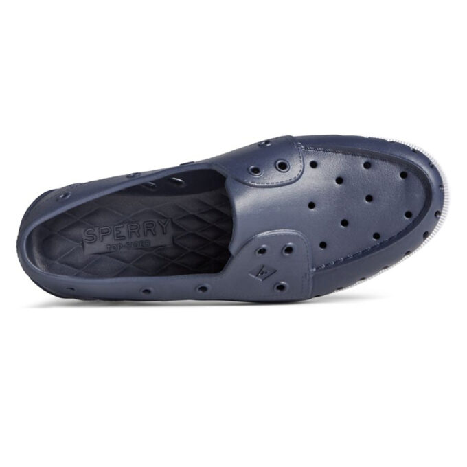 "Top view of a navy blue Sperry A/O FLOAT shoe showing perforations for ventilation and a quilted insole with the Sperry logo embossed."